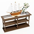 Wooden Coffee Table with Glass Top Featuring Sailing Ship Model and White Flower Vase