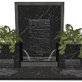 Outdoor Water Feature Wall With Flowing Water And Black Stone Structure Surrounded By Green Plants