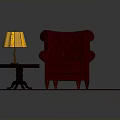 Red Tufted Armchair And Ottoman With Small Table Lamp On Round Rug With Orange Patterns