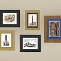 Various Framed Decorative Artworks With Architectural Prints On Beige Wall