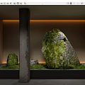 Garden Courtyard Design With Moss Covered Stones Warm Lighting And Concrete Pillar
