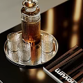 Elegant Wine Bottle With Textured Design And Transparent Glasses On Silver Tray Black Table
