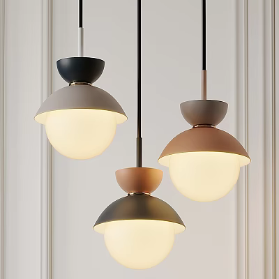 Three Modern Pendant Lights With Dome Shaped Colored Tops And Spherical White Shades 3d model