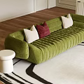 Green Three Seater Velvet Sofa with White and Red Cushions on Black and White Rug