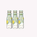 Three Bottles of Milk Beverage with Yellow Flowers Packaging Design on Light Background