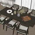 Modern Dining Table Set with Rattan Chairs Bowl Vase and Nuts on Herringbone Floor