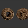Two Brown Coiled Twine Balls Placed On Black Reflective Surface 3d model
