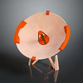 Circular Laboratory Equipment With Orange Components And Wooden Support Stand