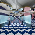 Stylish Hotel Public Lounge Area with Pink Blue Geometric Floor Circular Lighting and Sofas Chairs