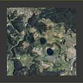 Aerial View of Mountainous Terrain With Green Vegetation Lakes and Agricultural Areas