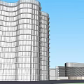Modern Office Building With Wavy Glass Facade And Adjacent Low Structure