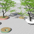 Colorful Tree Planters In Various Shapes With Green Trees On Paved Ground
