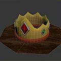 Golden Decorative Crown With Red And Green Diamond Shaped Gems On Wooden Hexagonal Base