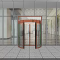 Modern Glass Building Entrance With Bronze Revolving Door And Stone Floor