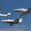 Three Different White Airplanes Flying In Clear Blue Sky With Clouds