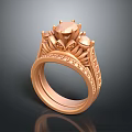 Luxury Rose Gold Ring Featuring Ornate Top Central Gemstone And Decorative Detailing