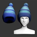 Blue Striped Knit Hat With Pom Pom Displayed On Mannequin Head