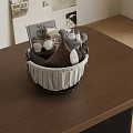Black And White Storage Basket With Gray Brown Plush Toys On Brown Tabletop