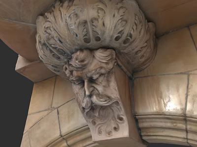 Classical Building Facade Featuring Carved Human Head Sculpture And Intricate Stone Patterns 3d model