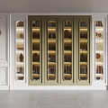 Elegant Modern Bookcase With Glass Doors Built-in Lighting And Decorative Items On White Walls