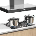 Kitchen Appliances Setup Featuring Range Hood Gas Stove And Stainless Steel Cooking Pots With Lids