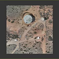 Desert Industrial Facility Aerial View With Two Large Cylindrical Tanks Vehicles Small Buildings and Vegetation