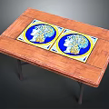 Wooden Dining Table Featuring Two Decorative Tiles Blue Background Figure Heads Yellow Borders Metal Legs