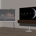 Two TVs On Stands Displaying Scenic Visuals With Wooden Soundbar In Living Room