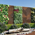 Living Plant Wall with Diverse Greenery Wooden Accents Enhancing Outdoor Space with Pebbles and Shrubs