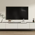 Modern White TV Stand with TV Green Plant Golden Decor and Stacked Books