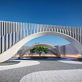 Modern Landscape Sculpture With Arched Vertical Striped Design Against Blue Sky And Paved Ground