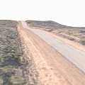 Scenic Desert Road Stretching Through Sandy Terrain With Low Vegetation Into Distance