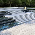 Outdoor Modern Stone Stairs With Water Feature And Surrounding Greenery Trees