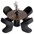 Modern Dining Set with Round Wooden Table Black Vase Plant and Four Black Chairs