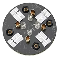 Elegant Black Round Dining Table Setup With Golden Vases Glassware And Napkins