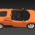 Orange Convertible Sports Car With Open Top Black Seats And White Wheels