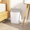 Modern Public Facility White Trash Can With Open Lid In Indoor Corner Area