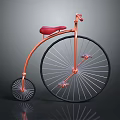 Vintage Classic Bicycle With Large Front Wheel Small Rear Wheel Orange Frame And Red Seat