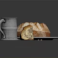 Fresh Crusty Bread On Silver Plate With Sliced Piece And Silver Mug And Crumbs