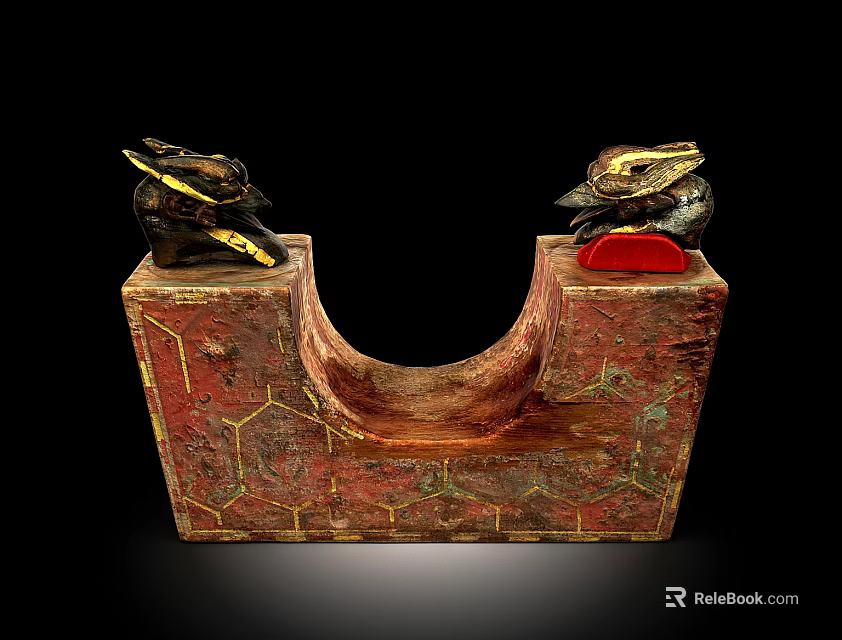 Decorative Red And Gold U Shaped Artifact With Animal Head Ornaments And Geometric Patterns 3d model 