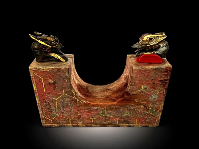 Decorative Red And Gold U Shaped Artifact With Animal Head Ornaments And Geometric Patterns 3d model