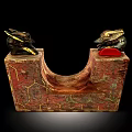 Decorative Red And Gold U Shaped Artifact With Animal Head Ornaments And Geometric Patterns