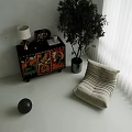Colorful Patterned Entryway Side Cabinet With Tall Plant And Lamp Near Sofa