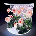 Modern Floral Installation with Large Pink Flowers Green Leaves Curved Illuminated Top and Geometric Background