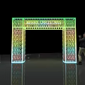Colorful Illuminated Archway Photo Spot With Text And Person Taking Photo On Reflective Floor