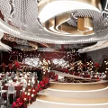 Luxurious Banquet Hall With Red Decorations Crystal Chandeliers Round Tables Fresh Flowers And Staircase Stage