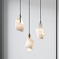Modern Pendant Lights With Unique Curved White Shades Hanging In Interior Space