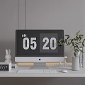 Apple iMac Desktop Setup On White Desk With Digital Time Green Plant And Rabbit Figurine