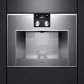 Modern Stainless Steel Coffee Machine With Digital Display And White Cup On Kitchen Counter