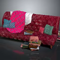 Red Tufted Sectional Sofa with Pink Plaid Blanket Colorful Cushions and Stack of Books